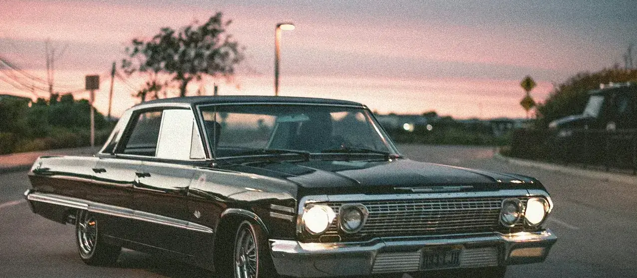 Classic Chevrolet Impala at dusk