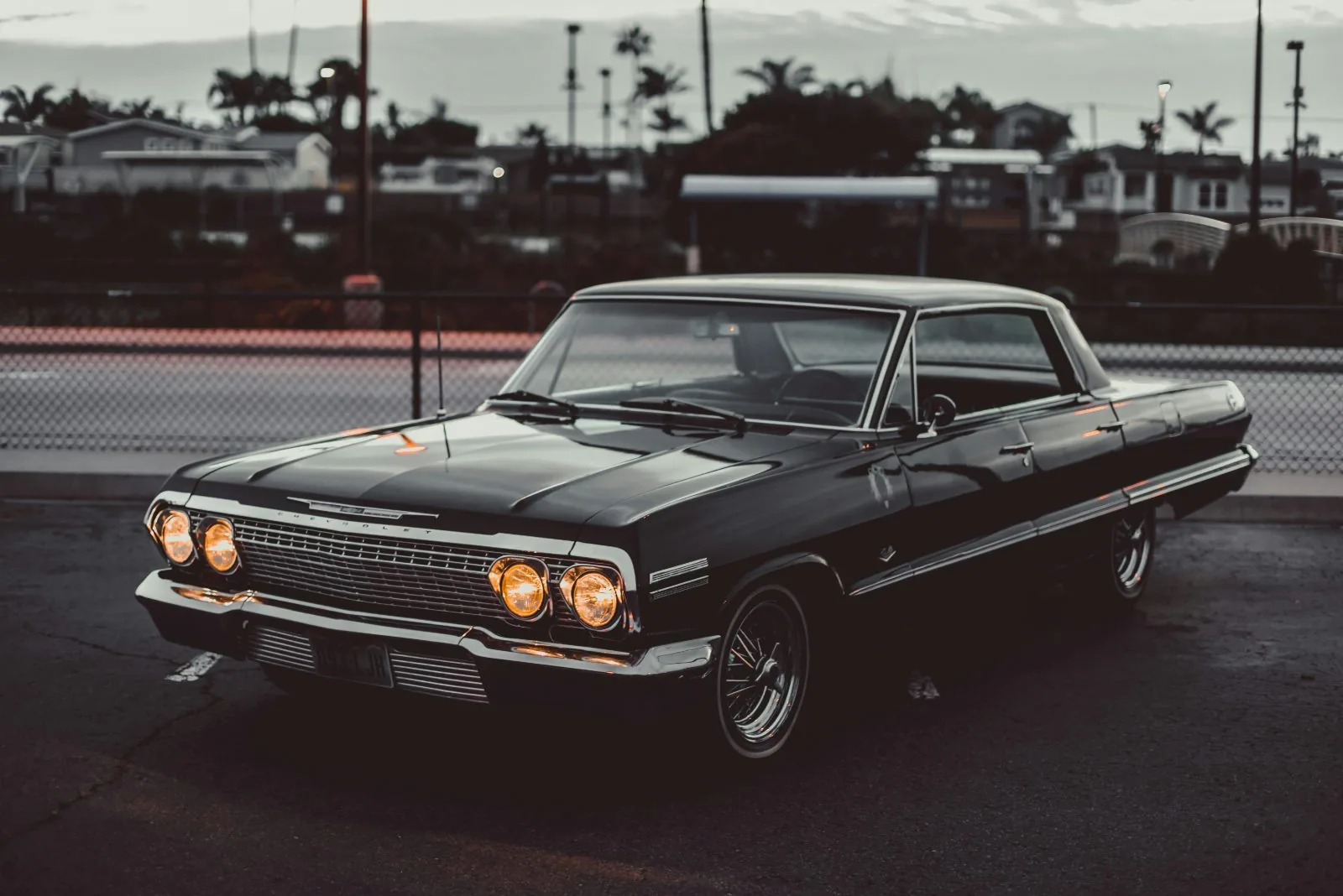 Black 1963 Chevrolet Impala Sport Coupe at dusk