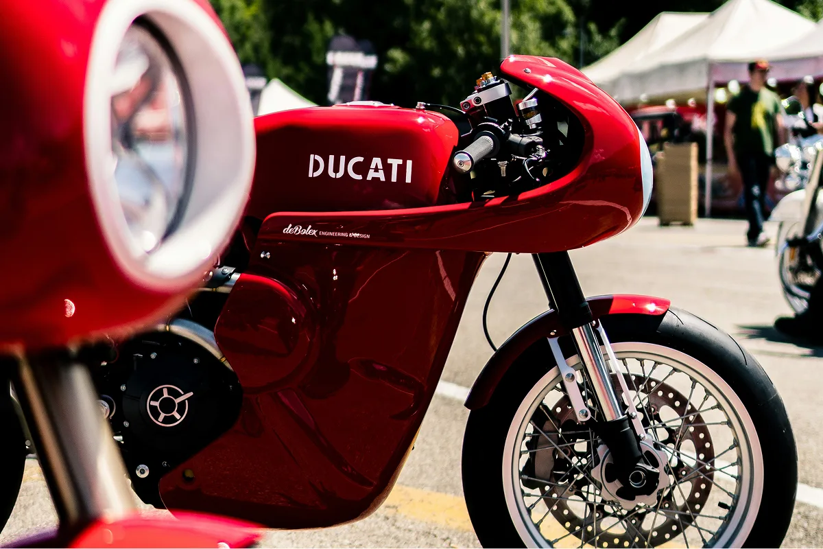 Ducati cafe racer motorcycle on display at an automotive show