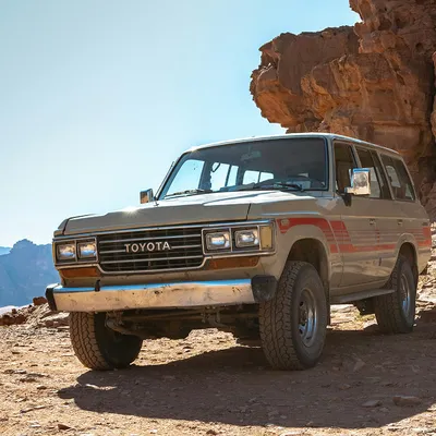 Toyota Land Cruiser FJ60 in desert landscape